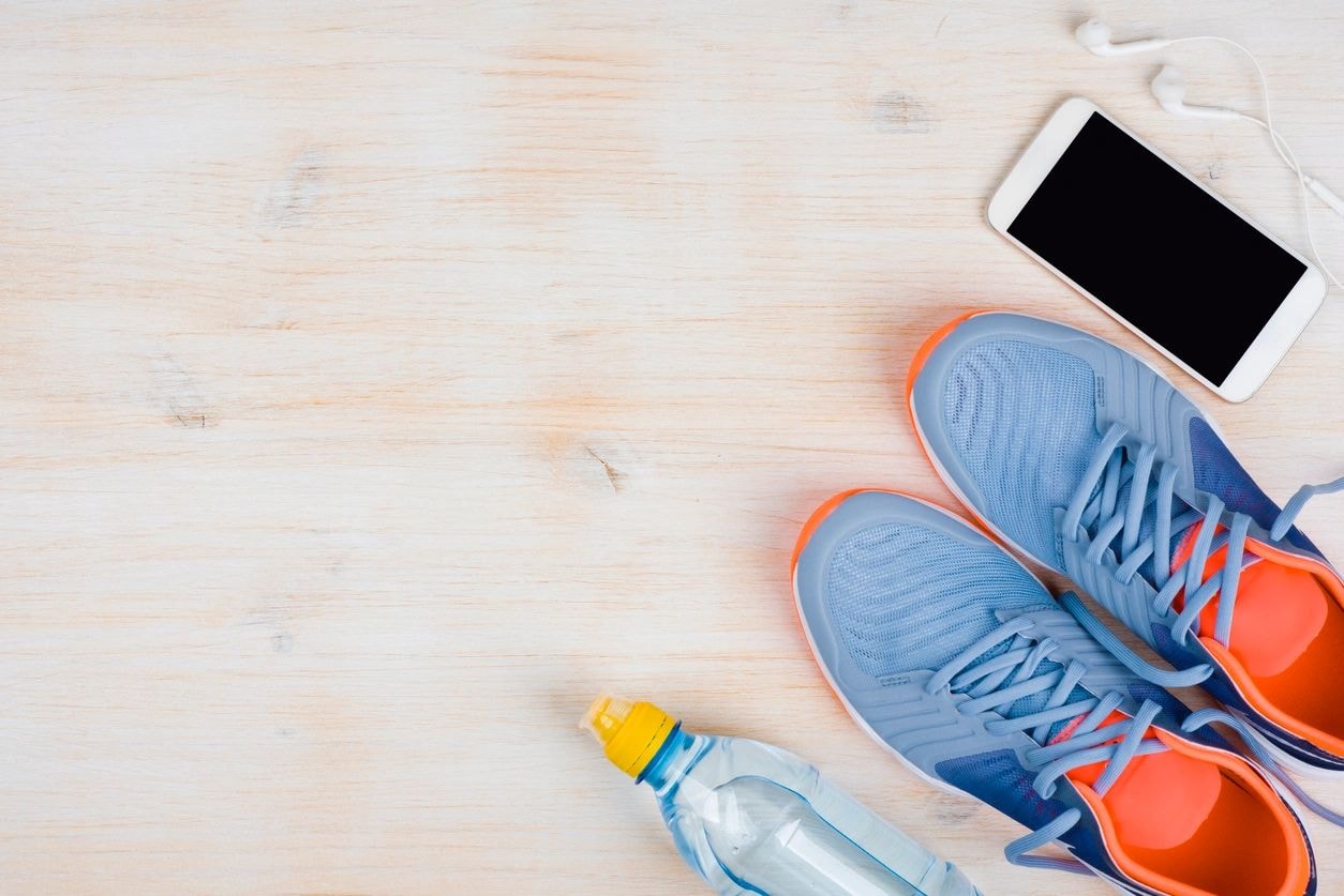 Fitness gear flat lay with running shoes