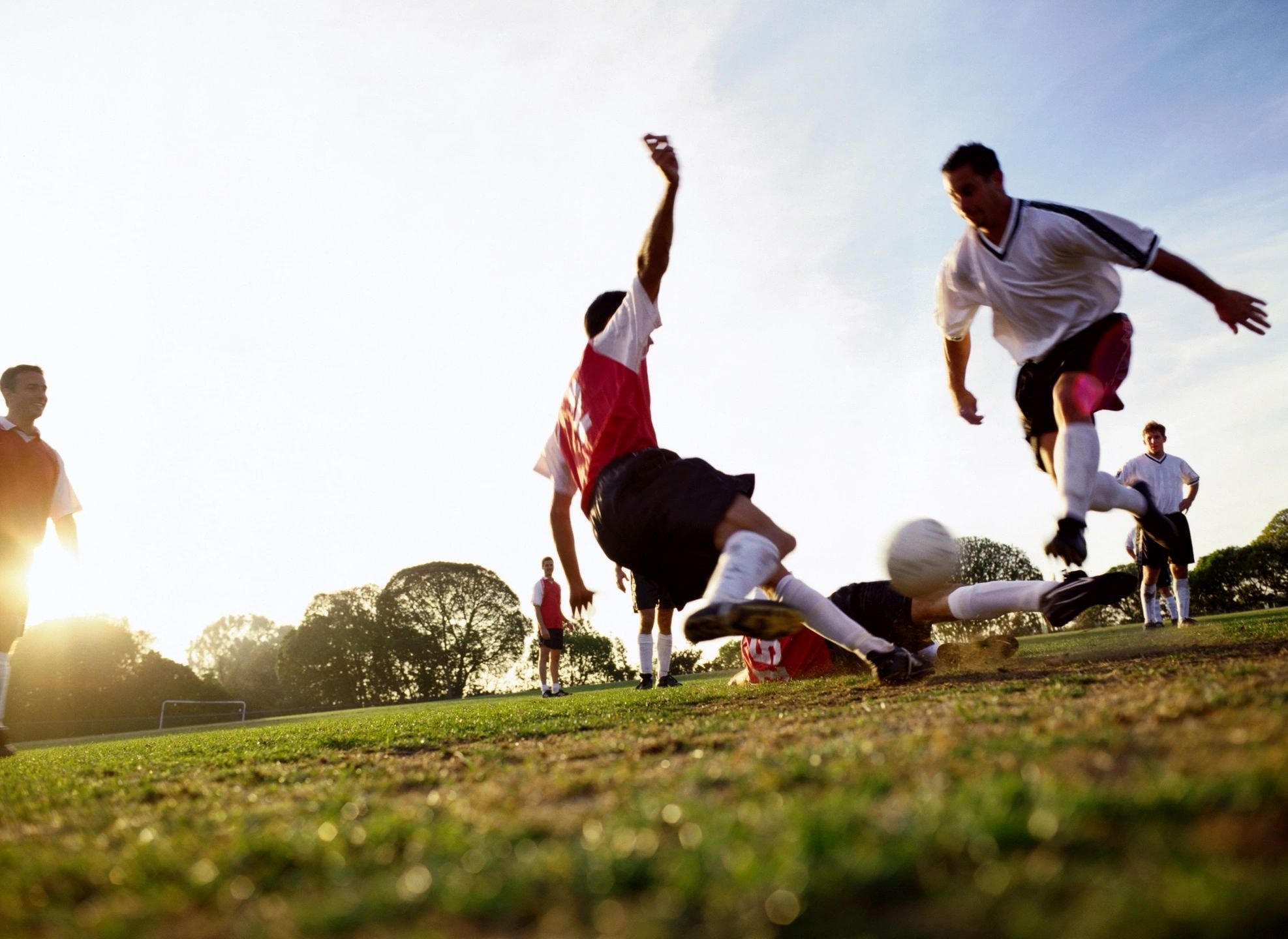 Soccer players in action on a sunny field
